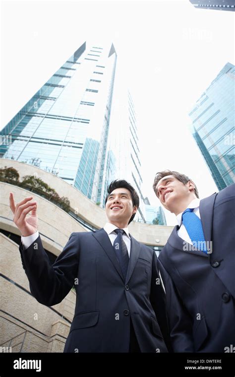 two business men talking outside Stock Photo - Alamy