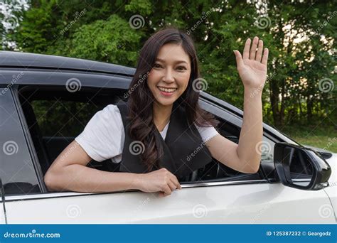 Happy Woman Open Window of Car and Raising Her Hand Stock Photo - Image ...