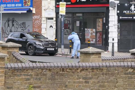 Lewisham shooting investigation in photos as police search flower beds, Mercedes and street ...