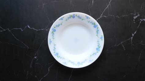 Piling up delicate porcelain plates 13755072 Stock Video at Vecteezy