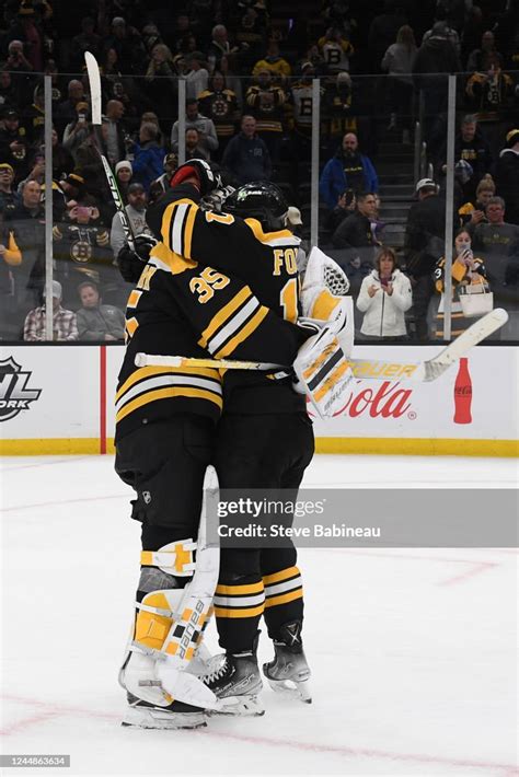 Linus Ullmark and Nick Foligno of the Boston Bruins hug after the win ...