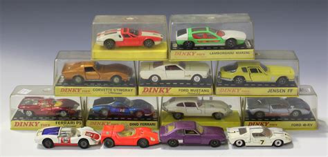 A small collection of Dinky Toys cars, comprising a No. 131 E-Type ...