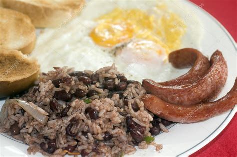 Breakfast in Nicaragua gallo pinto eggs sausage Stock Photo by ...