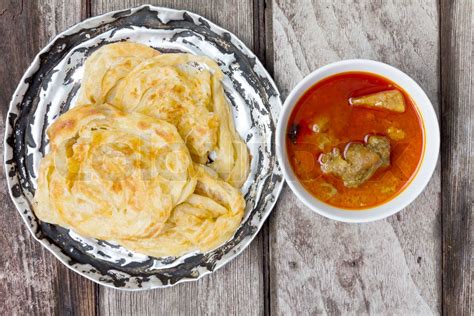 roti canai with spicy curry | Stock image | Colourbox