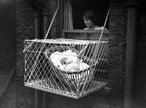 Incredible Pictures of Baby Cages Hanging Outside London Apartment Windows in the 1930s ...