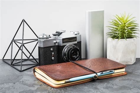 Free Photo | Front view laptop with camera on wooden background