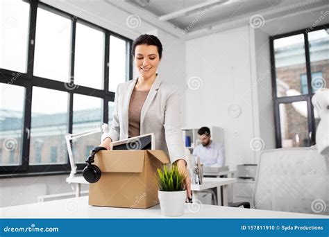 Happy Businesswoman with Personal Stuff at Office Stock Photo - Image ...