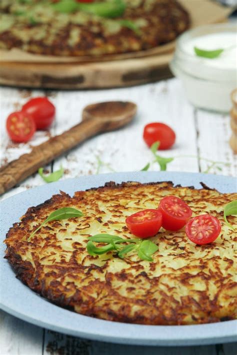 Rosti - Swiss Dish Made of Grated Potato Stock Photo - Image of ...