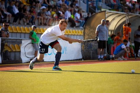 Free Photo | Field hockey player in equipment on the grass