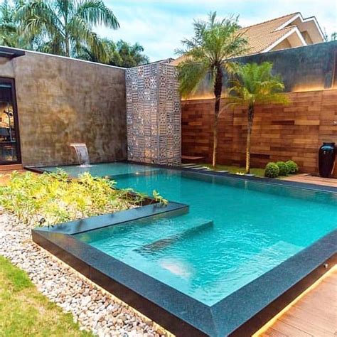 L-shaped pool with waterfall | Swimming pools backyard, Small pool ...