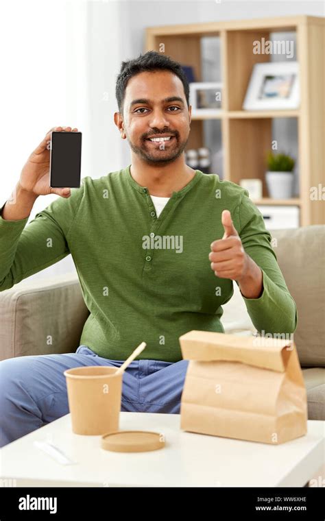 indian man using smartphone for food delivery Stock Photo - Alamy