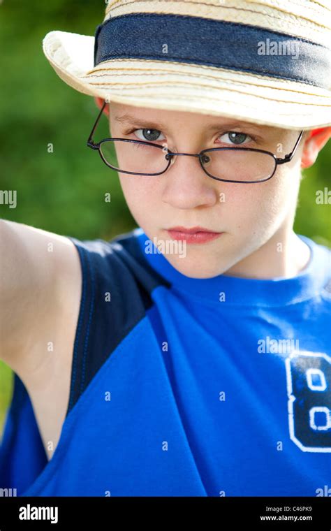 A boy with glasses and a hat Stock Photo - Alamy