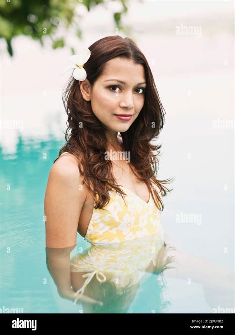 Woman in Pool at Heritance Kandalama Hotel, Dambulla, Sri Lanka. A woman bathes in the Infinity ...