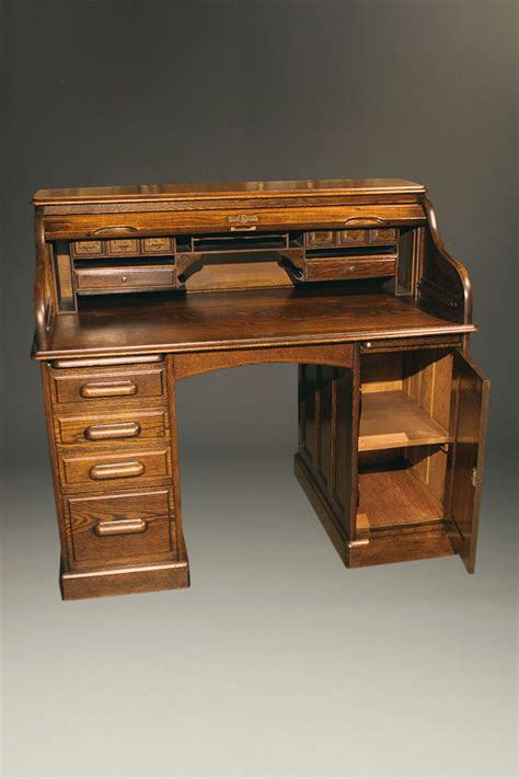 S-roll oak roll top desk.