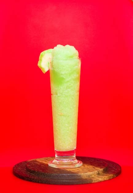 Premium Photo | Green guava smoothie in glass with guava fruit on red background,healthy detox ...