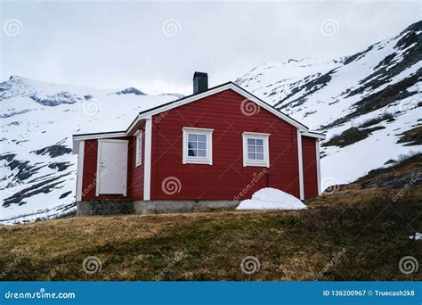 Norway Countryside. Classic Red Wooden Houses Near Mountains. Spring Time. Norwegian Cottage ...