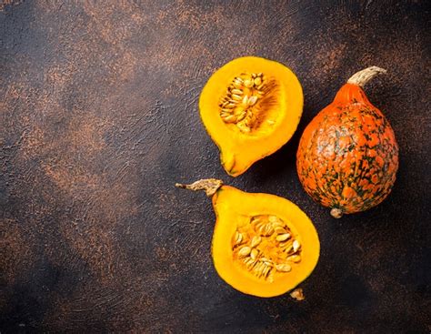 Premium Photo | Dissected raw hokkaido pumpkin with seeds