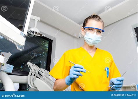 Female Dentist with Tools stock photo. Image of attractive - 58867250