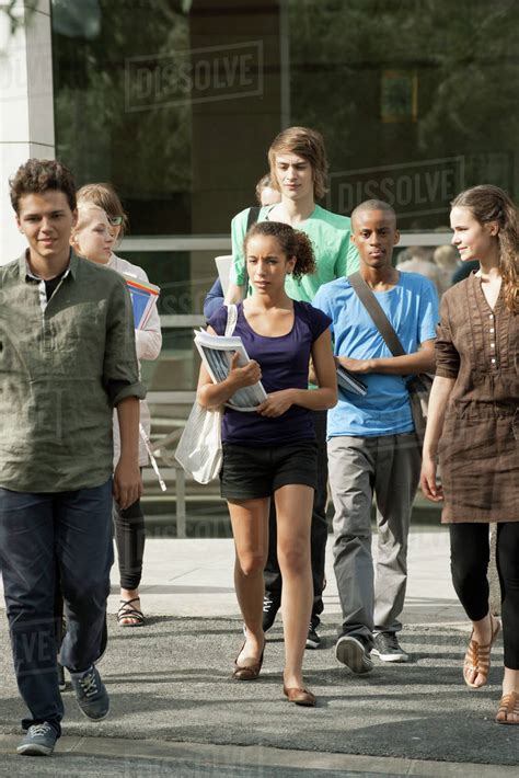 University students walking on campus - Stock Photo - Dissolve