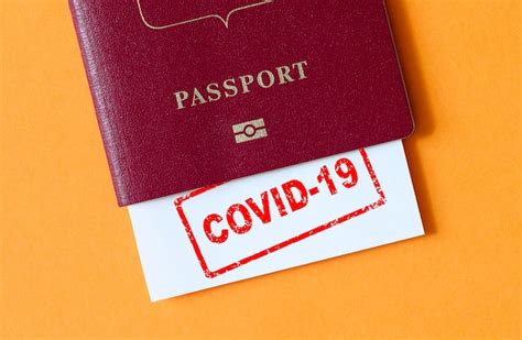 Premium Photo | Travel and coronavirus concept covid19 stamp in tourist passport