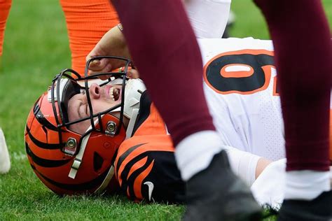 Joe Burrow injury: Bengals quarterback carted off after hit to knee