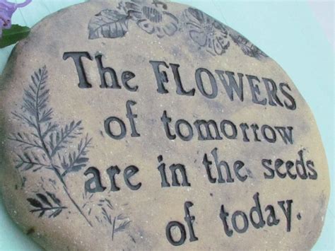 Garden stone with Gardening quote The flowers of