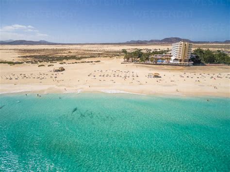 Aerial view of Corralejo’s Big Beaches with turquoise sea in Fuerteventura, Canary Islands ...