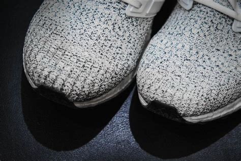 Close up of knitted sneakers on black surface - Creative Commons Bilder