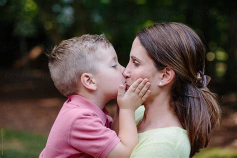 "Cute Young Boy Giving His Mother An Affectionate Kiss On The Mouth" by Stocksy Contributor ...