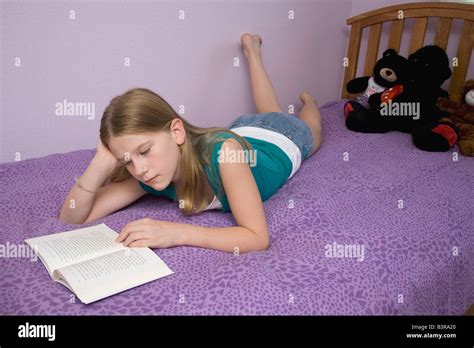 Preteen girl lying on stomach hi-res stock photography and images - Alamy