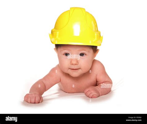 3 Month old baby wearing builders hard hat cutout Stock Photo - Alamy