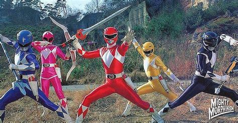 the power rangers are posing for a photo in front of some hills and ...