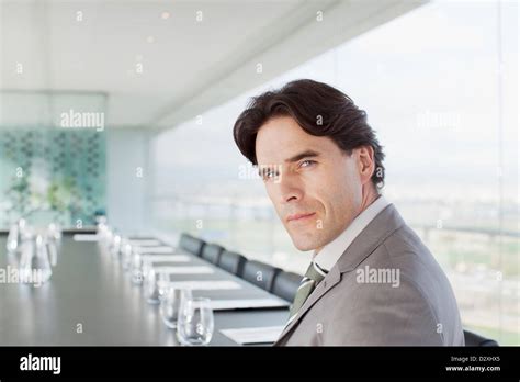 Portrait of confident businessman in conference room Stock Photo - Alamy
