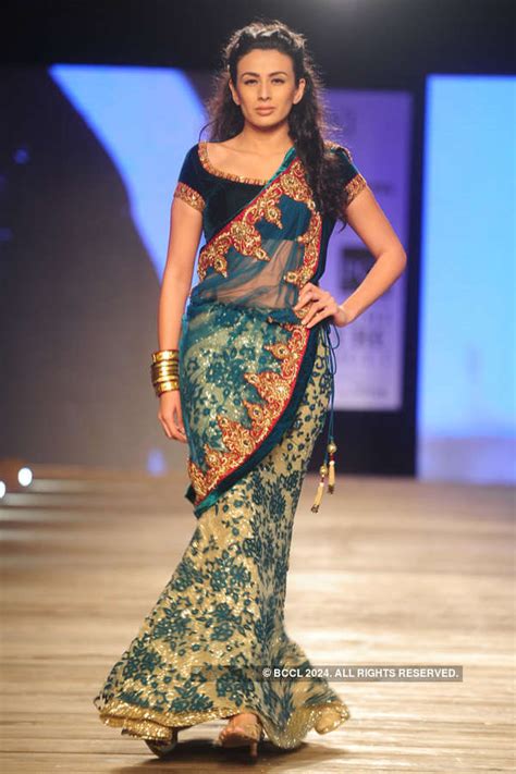 Ericka Packard showcases a creation by designer Monisha Jaising on Day ...