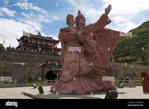 Standing at the North Gate entrance, seen from outside the walls, of the Songpan Ancient Town is ...