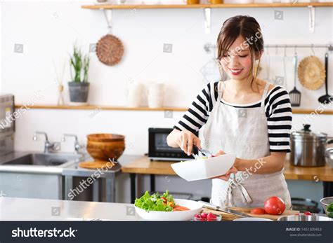 Asian girl cooking Images, Stock Photos & Vectors | Shutterstock