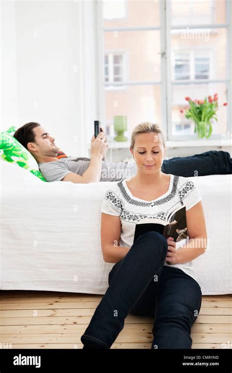 Man and woman in bedroom Stock Photo - Alamy