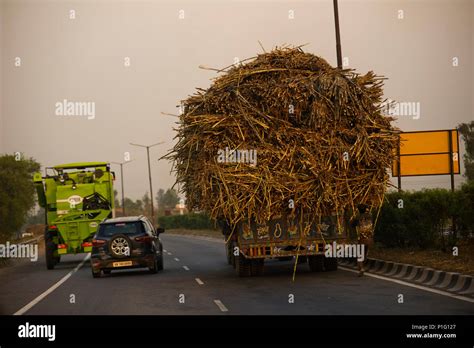 Overloaded truck at the road near New Delhi, India Stock Photo - Alamy