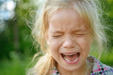 Sad little girl crying stock image. Image of pouring - 34492093