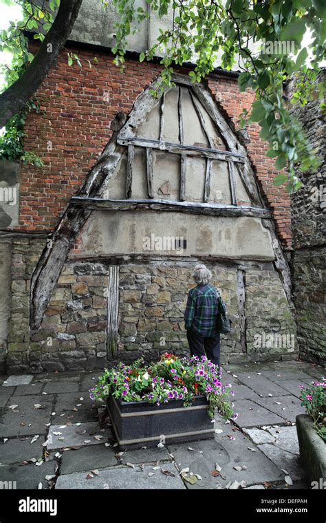 A wooden cruck remaining from the demolition of an old medieval building, High Street ...