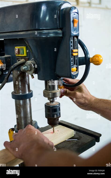 Carpenter using a drill Stock Photo - Alamy