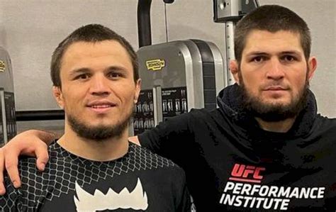 Download Caption: Umar Nurmagomedov and Khabib Nurmagomedov Engrossed in Gym Training Session ...