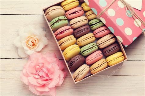 Colorful macaroons in gift box and roses — Stock Photo © karandaev #121775952