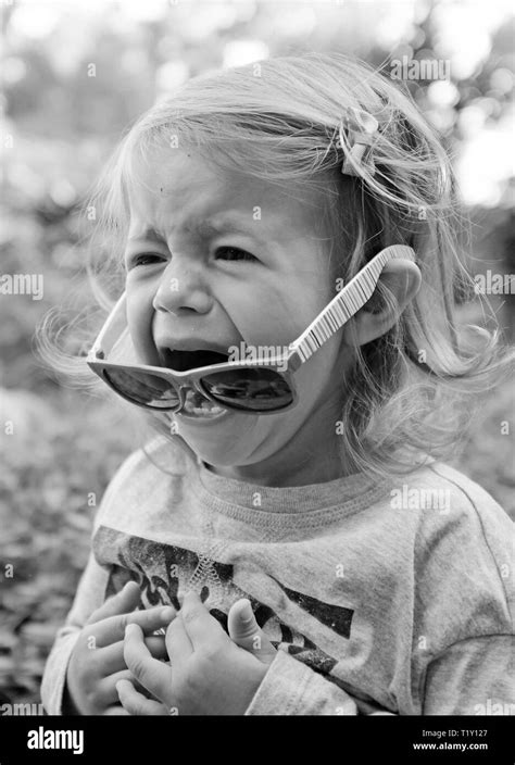 Pretty cute little girl crying Black and White Stock Photos & Images - Alamy