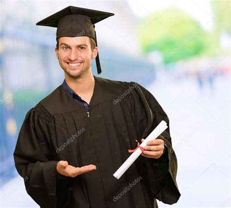 Young Graduation Man Holding Certificate Stock Photo by ©Krakenimages.com 18779137