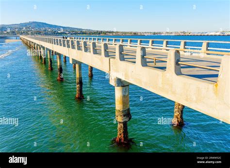 Close-up side view of the concrete structure of the Cabrillo Beach Pier ...