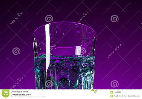 The Water Splashing in Glass on Lilac Background Stock Image - Image of colored, motion: 112276331