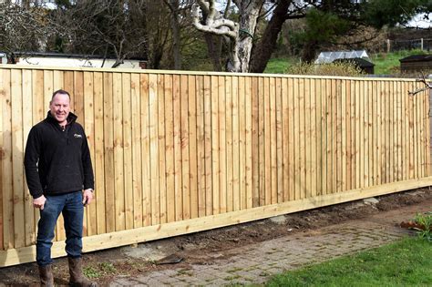 Installing feather board fencing - Weymouth Tree Surgeon