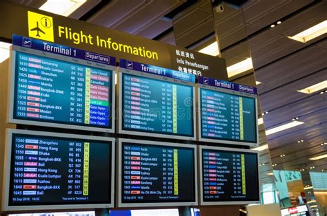 Arrival Departure Board Showing Departing Flights in Changi Airport, Singapore. Editorial Stock ...