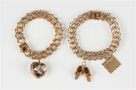 Two Vintage 14K Gold Charm Bracelets | Cottone Auctions